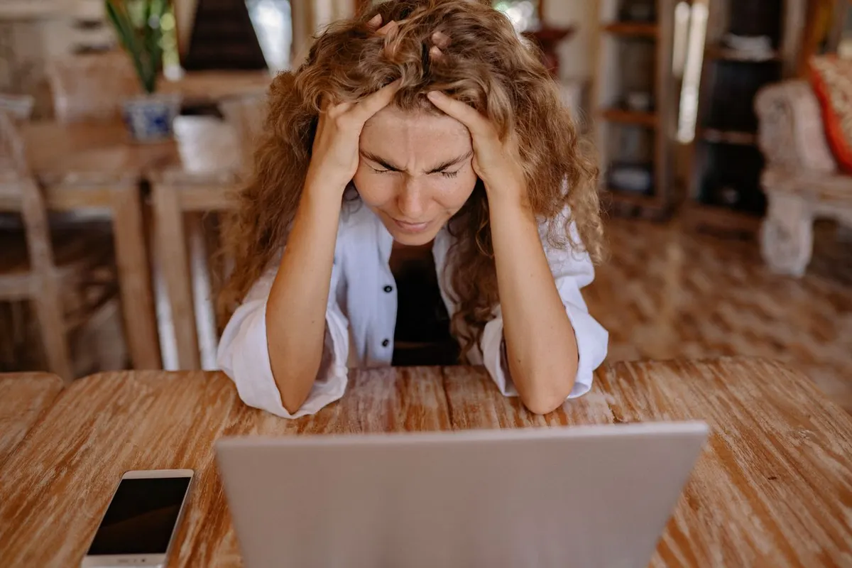 A woman feeling frustrated and overwhelmed at home